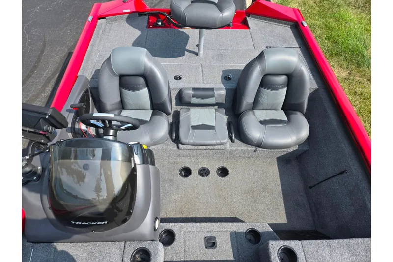 Slide: The Image of 2020 Tracker Pro Team 195 TXW Tournament Edition boat interior with gray seating and steering console. - 23