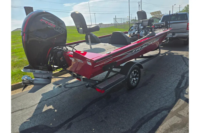Slide: The Image of 2020 Tracker Pro Team 195 TXW Tournament Edition boat on trailer, parked outdoors. - 3