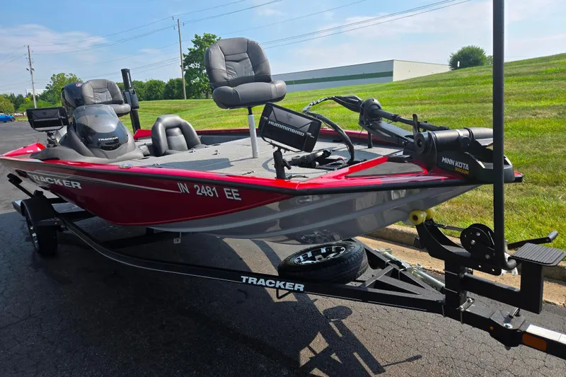 Slide: The Image of 2020 Tracker Pro Team 195 TXW Tournament Edition boat on trailer, parked outdoors. - 5