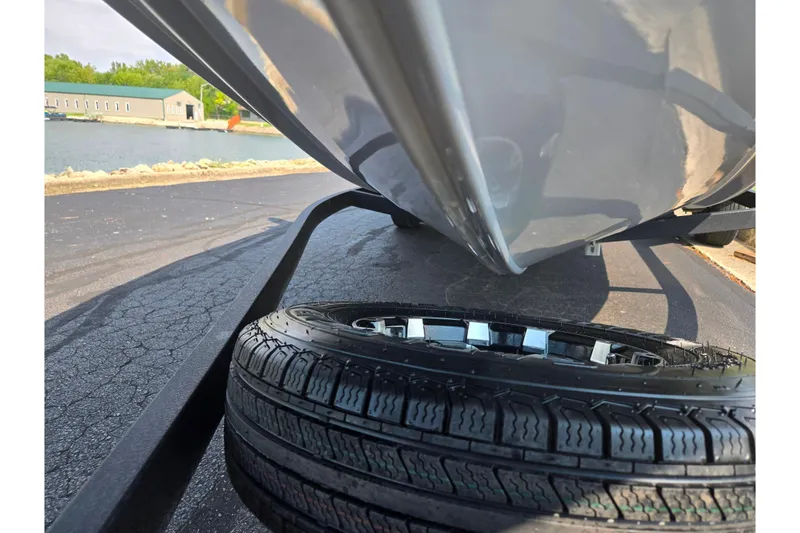 Slide: The Image of 2020 Tracker Pro Team 195 TXW Tournament Edition boat on trailer, close-up view. - 7