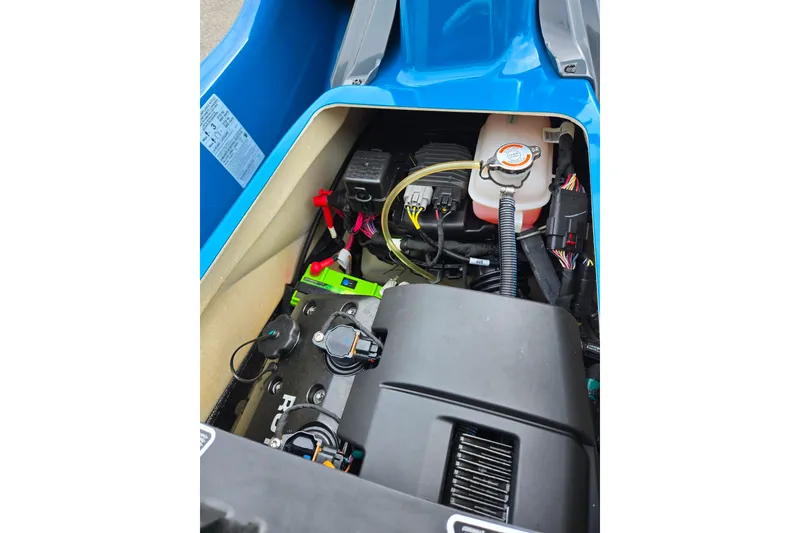 Slide: The Image of 2019 Sea-Doo GTX 230 engine compartment, showcasing internal components and wiring. - 11