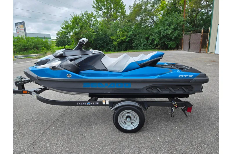 Slide: The Image of 2019 Sea-Doo GTX 230 jet ski on trailer, parked outdoors. - 4