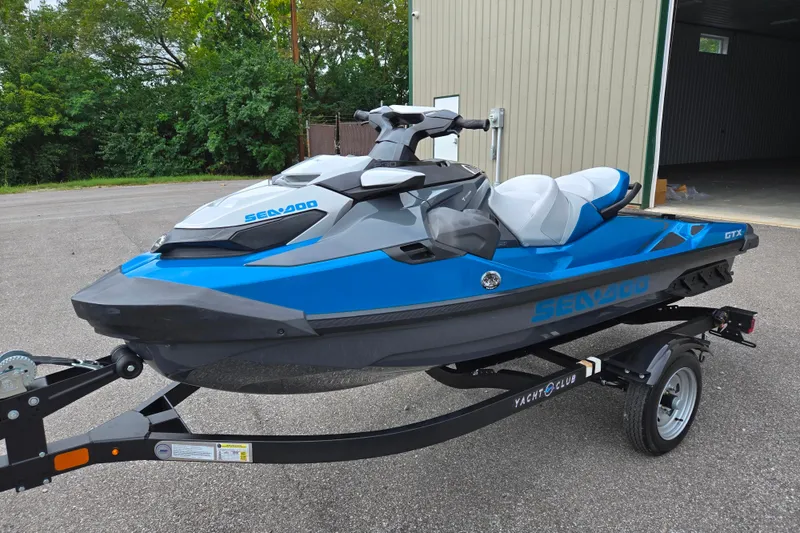 Slide: The Image of 2019 Sea-Doo GTX 230 jet ski on trailer, parked outdoors. - 5