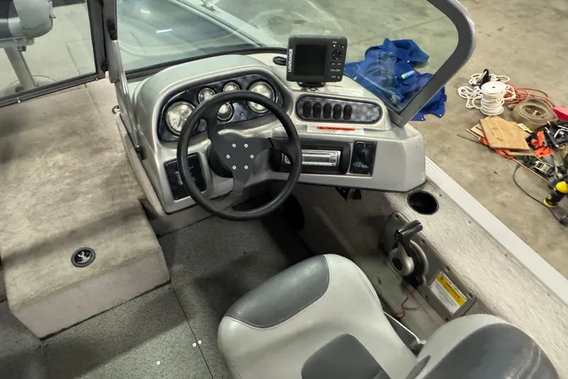 Slide: The Image of 2011 G3 Angler V172 FS boat cockpit with steering wheel and control panel. - 7