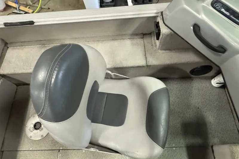 Slide: The Image of 2011 G3 Angler V172 FS boat interior with gray seat and carpeted floor. - 9