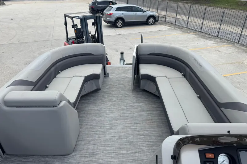 Slide: The Image of 2021 Bennington SX21 pontoon boat with spacious seating and modern design. - 11
