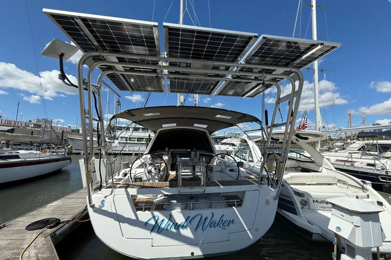 Slide: The Image of 2013 Beneteau Oceanis 41 sailboat with solar panels docked at marina. - 14