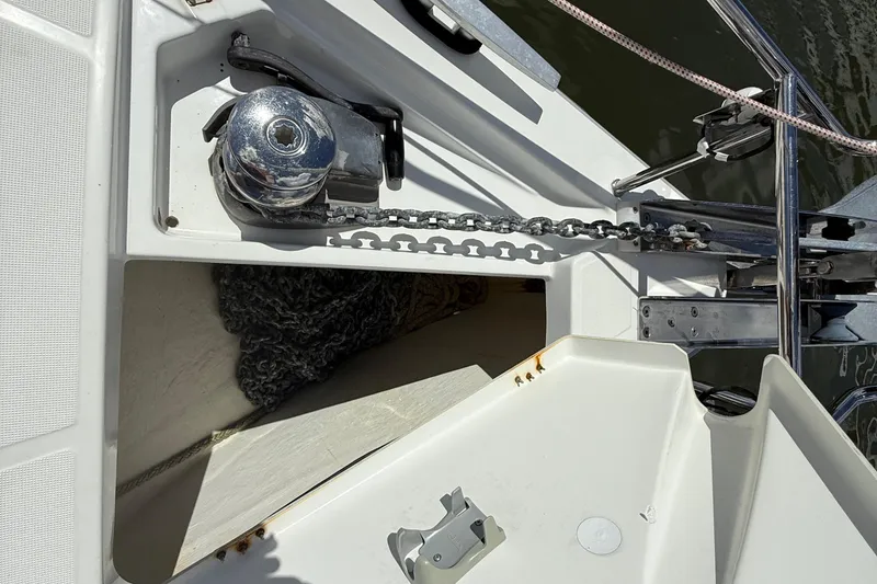 Slide: The Image of Anchor chain and windlass on 2013 Beneteau Oceanis 41 sailboat deck. - 22