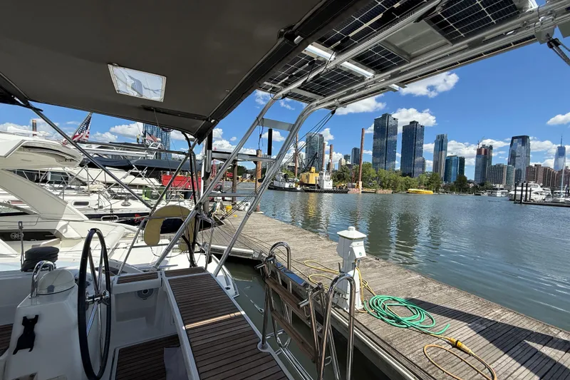 Slide: The Image of Beneteau Oceanis 41 sailboat docked with city skyline in the background, 2013 model. - 41