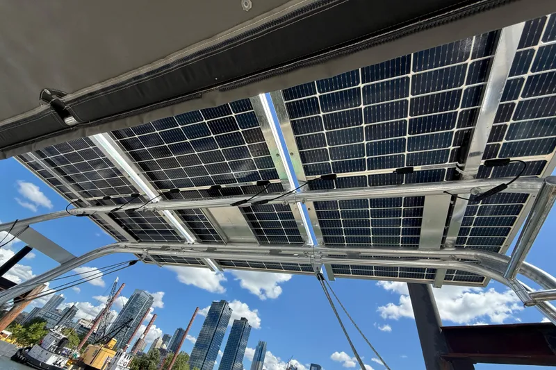 Slide: The Image of Solar panels on a 2013 Beneteau Oceanis 41 yacht with city skyline background. - 42