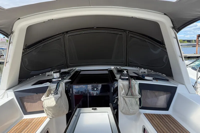Slide: The Image of Cockpit of 2013 Beneteau Oceanis 41 sailboat with covered helm and winches. - 44