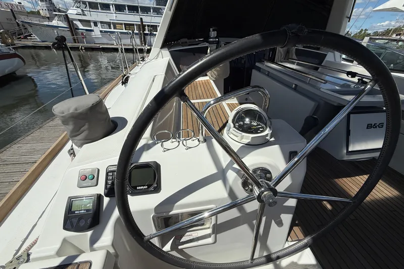 Slide: The Image of Steering wheel and controls of 2013 Beneteau Oceanis 41 sailboat at dock. - 49