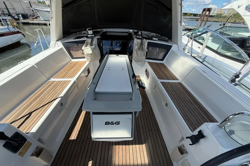 Slide: The Image of 2013 Beneteau Oceanis 41 yacht cockpit with teak flooring and modern equipment. - 51