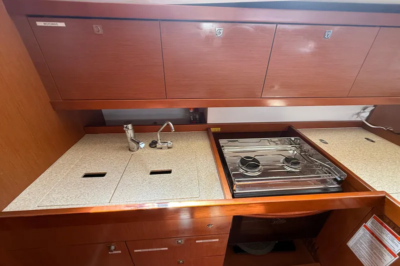 Slide: The Image of Galley kitchen in 2013 Beneteau Oceanis 41 yacht with stove and sink. - 58