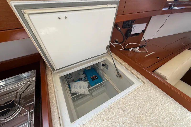 Slide: The Image of Beneteau Oceanis 41 (2013) yacht interior with open freezer compartment. - 63