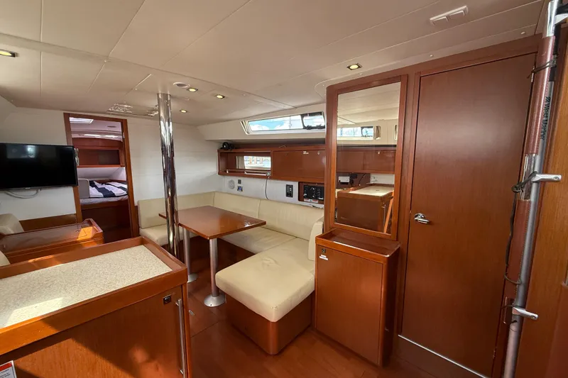 Slide: The Image of Interior of 2013 Beneteau Oceanis 41 yacht with cozy seating and modern amenities. - 65