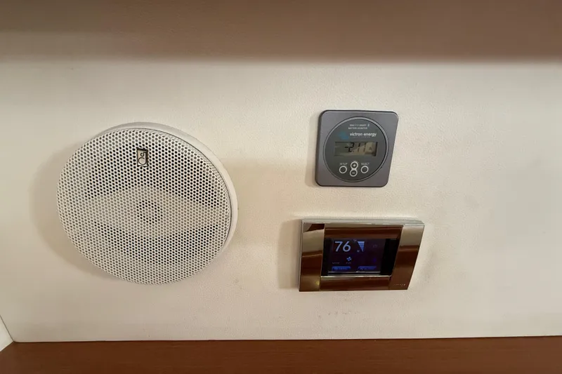 Slide: The Image of Interior controls of a 2013 Beneteau Oceanis 41 yacht, featuring a speaker and digital displays. - 71