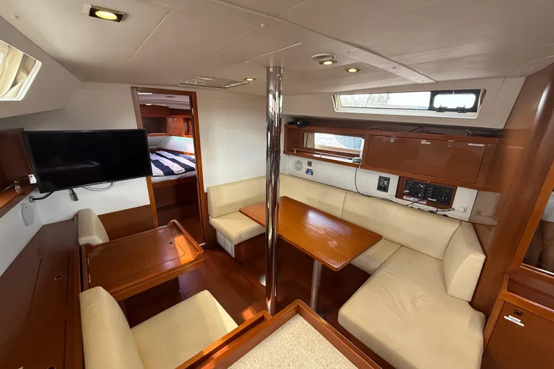 Slide: The Image of Interior of 2013 Beneteau Oceanis 41 yacht with cozy seating and modern amenities. - 76