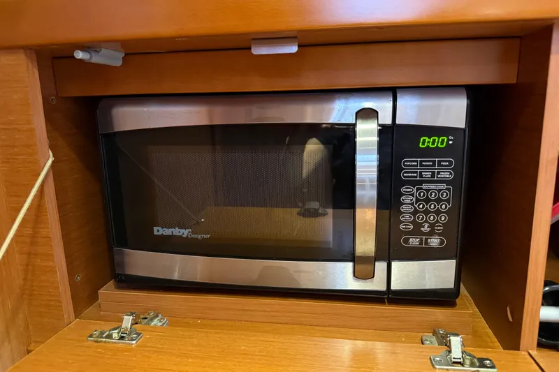 Slide: The Image of Microwave inside Beneteau Oceanis 41 yacht, 2013 model, with wooden cabinetry. - 79