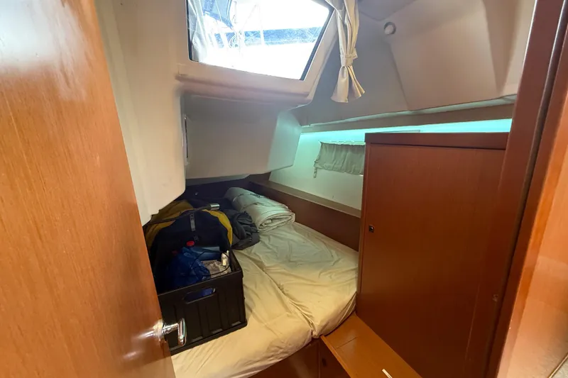 Slide: The Image of Cozy cabin interior of 2013 Beneteau Oceanis 41 sailboat with bed and storage. - 85