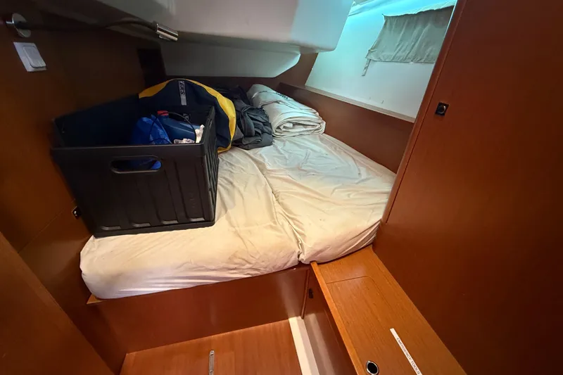 Slide: The Image of Cozy cabin interior of 2013 Beneteau Oceanis 41 sailboat with bed and storage. - 86