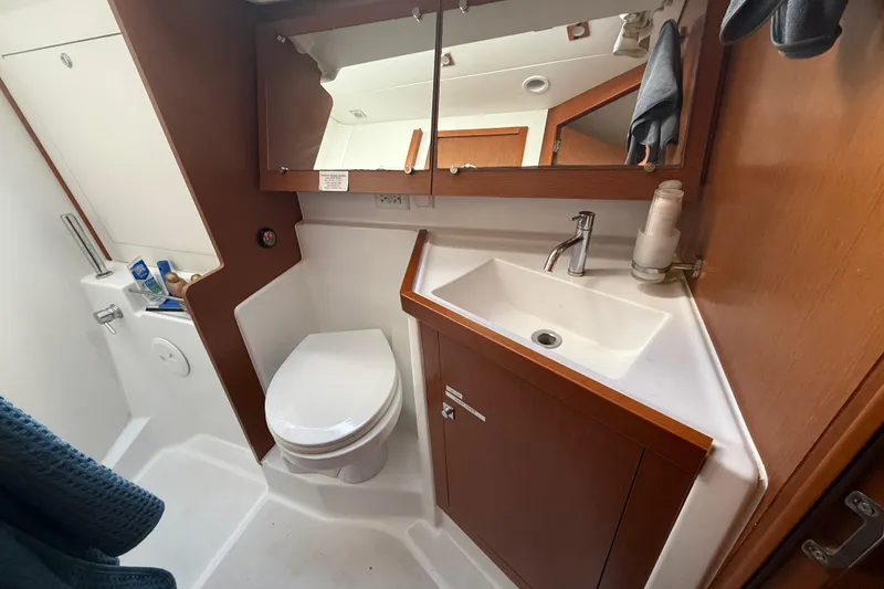Slide: The Image of Bathroom interior of 2013 Beneteau Oceanis 41 yacht with sink, toilet, and mirror. - 90