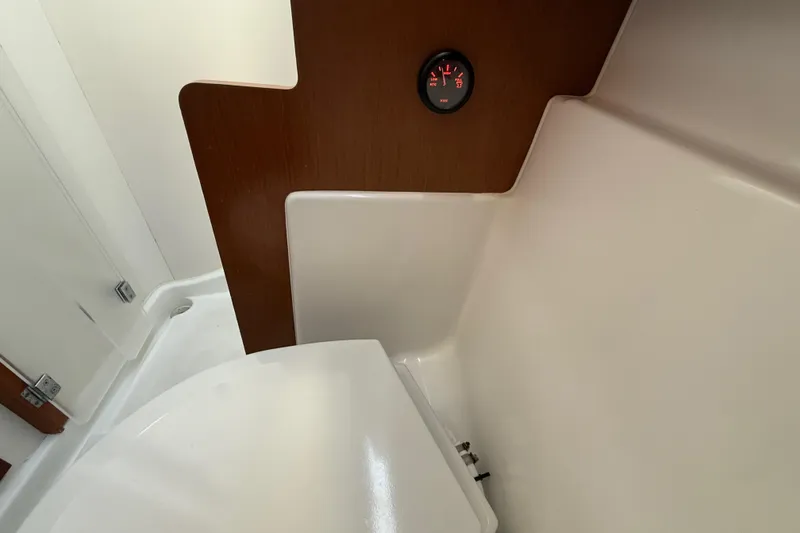Slide: The Image of Interior of 2013 Beneteau Oceanis 41 yacht bathroom with wood paneling and gauge. - 91