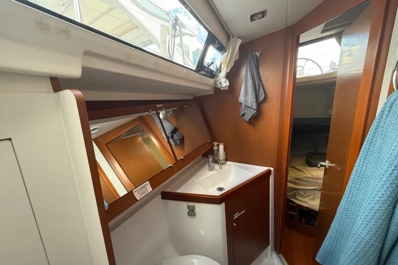 Slide: The Image of Interior of 2013 Beneteau Oceanis 41 yacht bathroom with sink and mirror. - 93