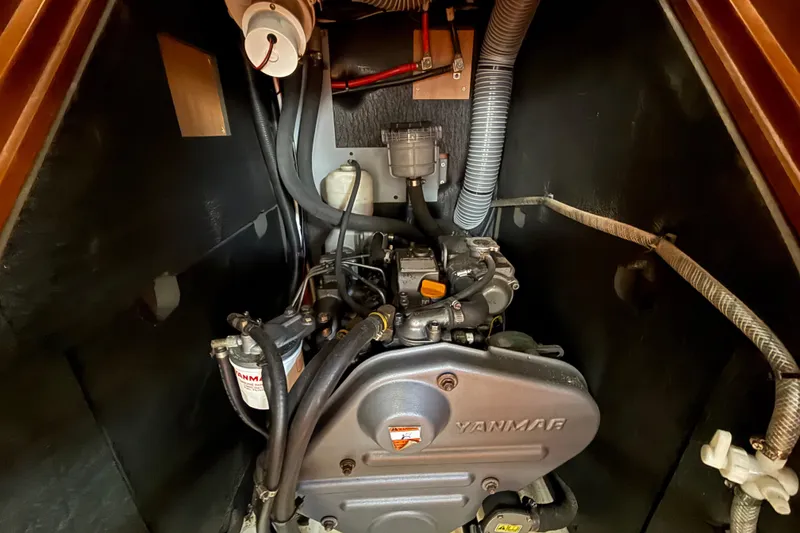 Slide: The Image of Engine compartment of a 2013 Beneteau Oceanis 41 sailboat, featuring a Yanmar engine. - 98