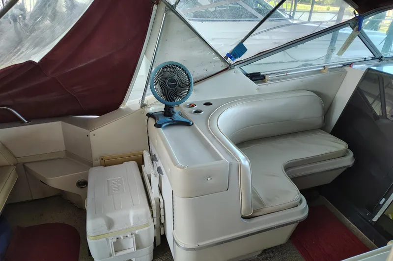 Slide: The Image of 1989 Wellcraft Gran Sport 3400 interior with seating, fan, and cooler. - 21