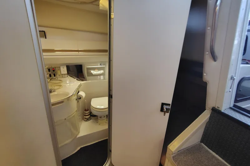 Slide: The Image of Interior view of 1989 Wellcraft Gran Sport 3400 boat bathroom with toilet and sink. - 29