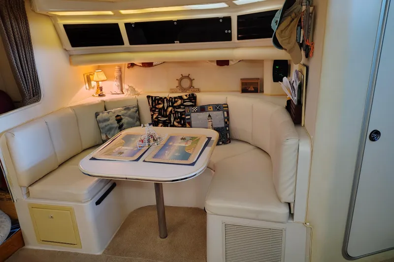 Slide: The Image of Interior of 1989 Wellcraft Gran Sport 3400 with cozy seating and nautical decor. - 31