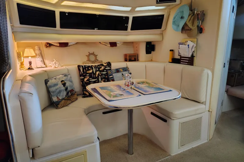 Slide: The Image of Interior of 1989 Wellcraft Gran Sport 3400 with cozy seating and nautical decor. - 33