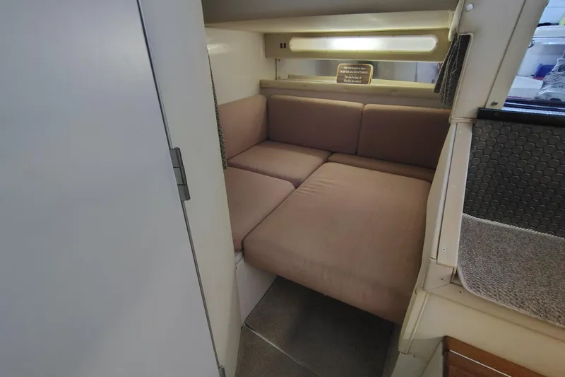 Slide: The Image of Interior cabin of 1989 Wellcraft Gran Sport 3400 with beige seating. - 38