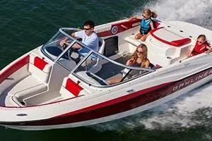 Slide: The Image of 2013 Bayliner 185 Bowrider cruising on water with passengers enjoying the ride. - 9