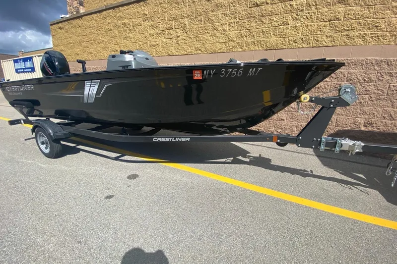 Slide: The Image of 2023 Crestliner 1650 Discovery SC boat on trailer, parked outdoors. - 3