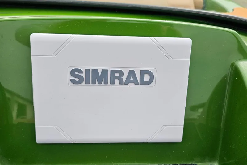 Slide: The Image of Simrad device on green Heyday WTSurf 2025 boat dashboard. - 11