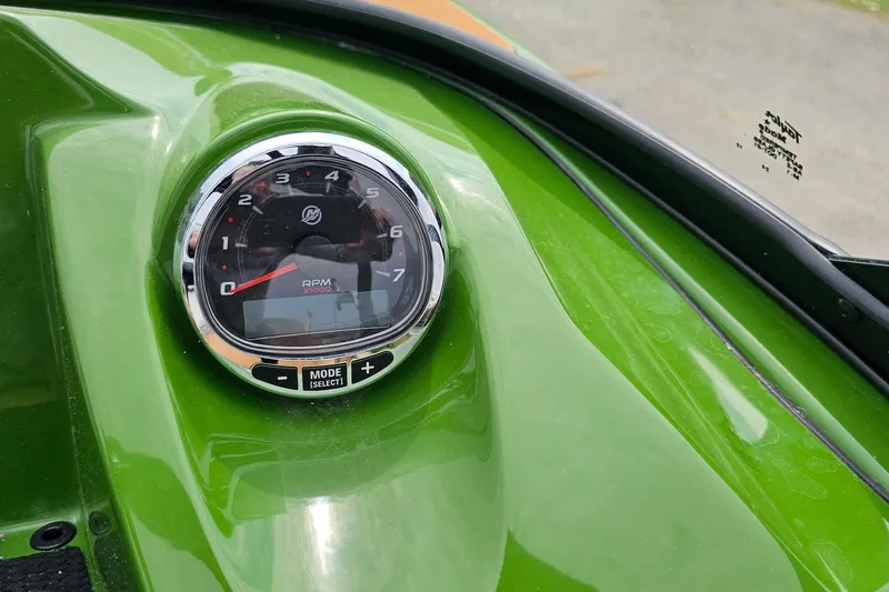 Slide: The Image of Close-up of 2025 Heyday WTSurf boat RPM gauge on green dashboard. - 12