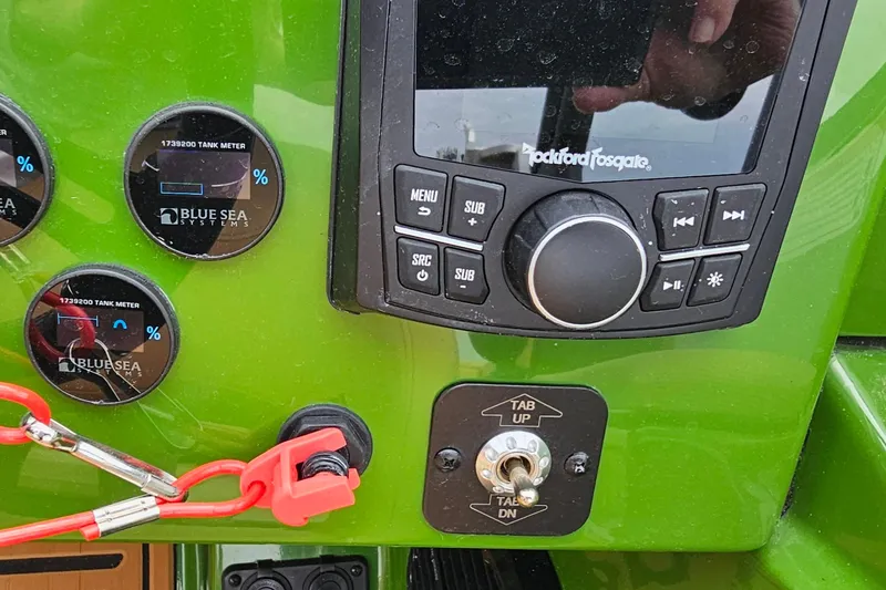 Slide: The Image of Control panel of 2025 Heyday WTSurf boat with gauges and audio system. - 13