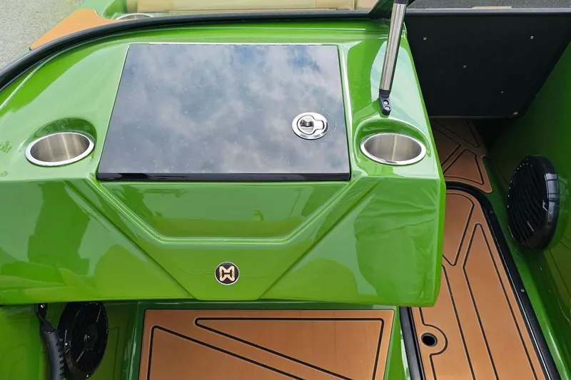 Slide: The Image of Green 2025 Heyday WTSurf boat interior with cup holders and sleek design. - 14