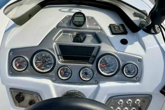 Slide: The Image of Dashboard of 2023 Tahoe 2150 boat with gauges and controls. - 6