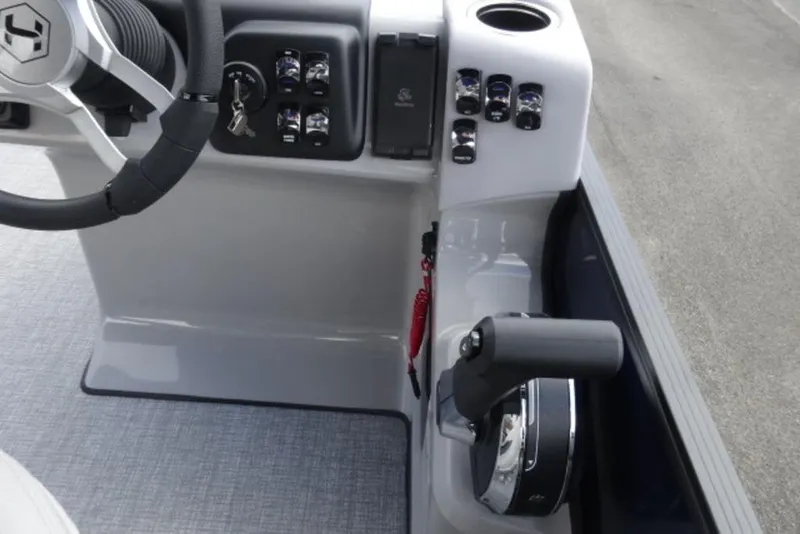 Slide: The Image of 2026 Harris Cruiser 230 Heritage Edition boat console with steering wheel and controls. - 10