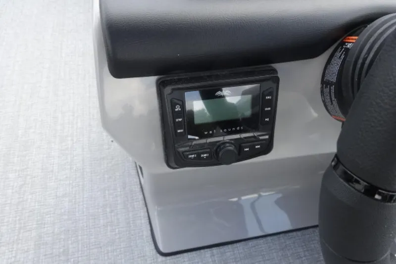 Slide: The Image of 2026 Harris Cruiser 230 Heritage Edition dashboard with audio control panel. - 4