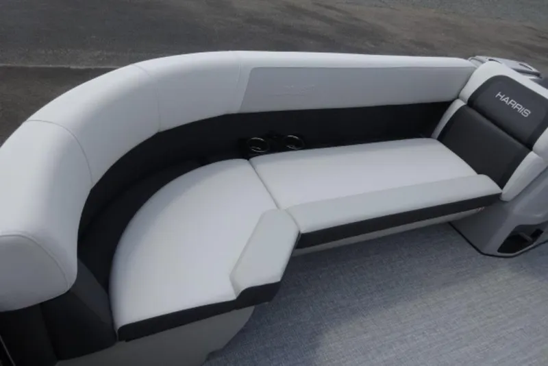 Slide: The Image of 2026 Harris Cruiser 230 Heritage Edition boat interior with sleek seating design. - 5
