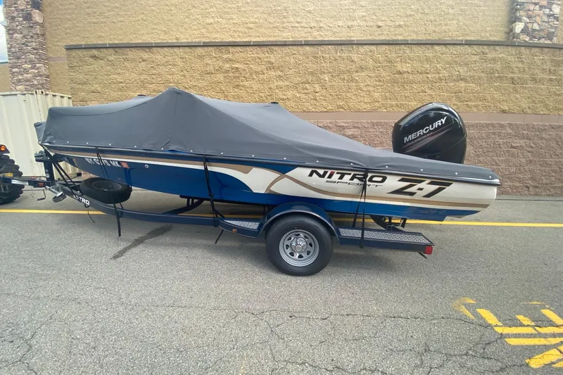 The Image of 2014 Nitro Z7 Sport boat with cover and Mercury engine on trailer. - 0