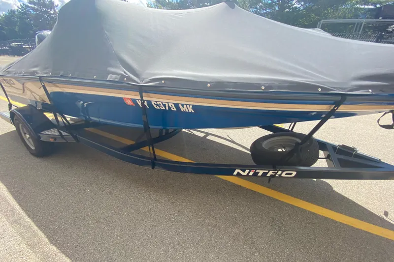 Slide: The Image of Covered 2014 Nitro Z7 Sport boat on trailer, parked on asphalt. - 3