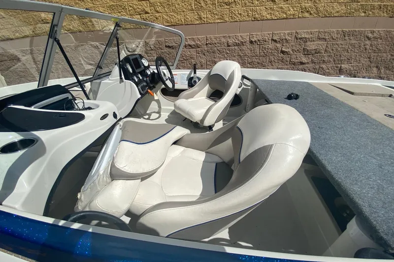 Slide: The Image of 2014 Nitro Z7 Sport boat interior with white seats and steering console. - 7