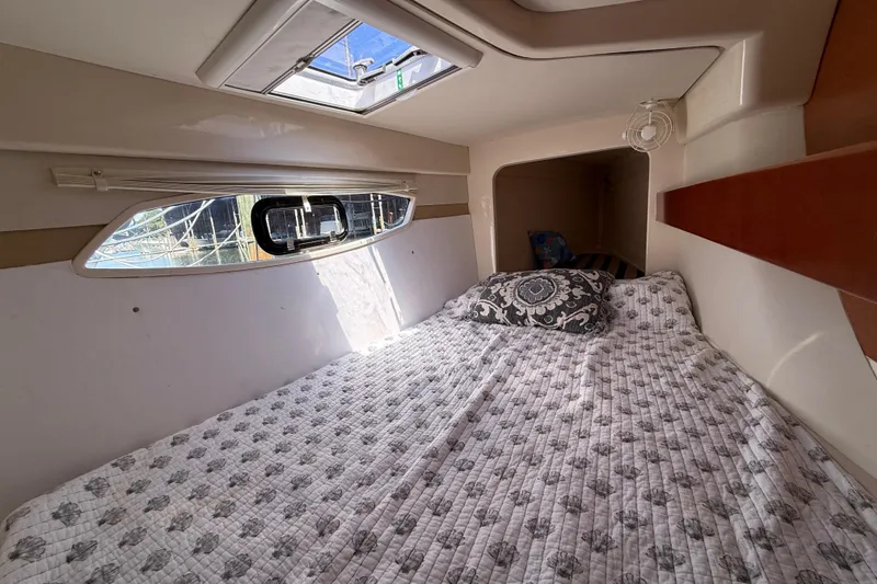Slide: The Image of Cozy cabin interior of 2010 Leopard 38 catamaran with bed and window view. - 102