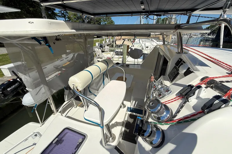 Slide: The Image of 2010 Leopard 38 catamaran cockpit with steering wheel, winches, and seating area. - 18