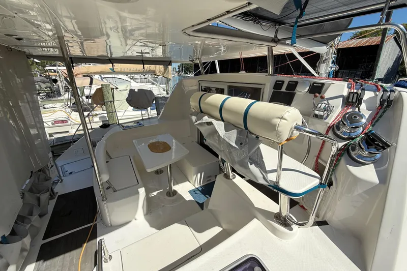 Slide: The Image of Interior view of a 2010 Leopard 38 catamaran cockpit with seating and navigation controls. - 19